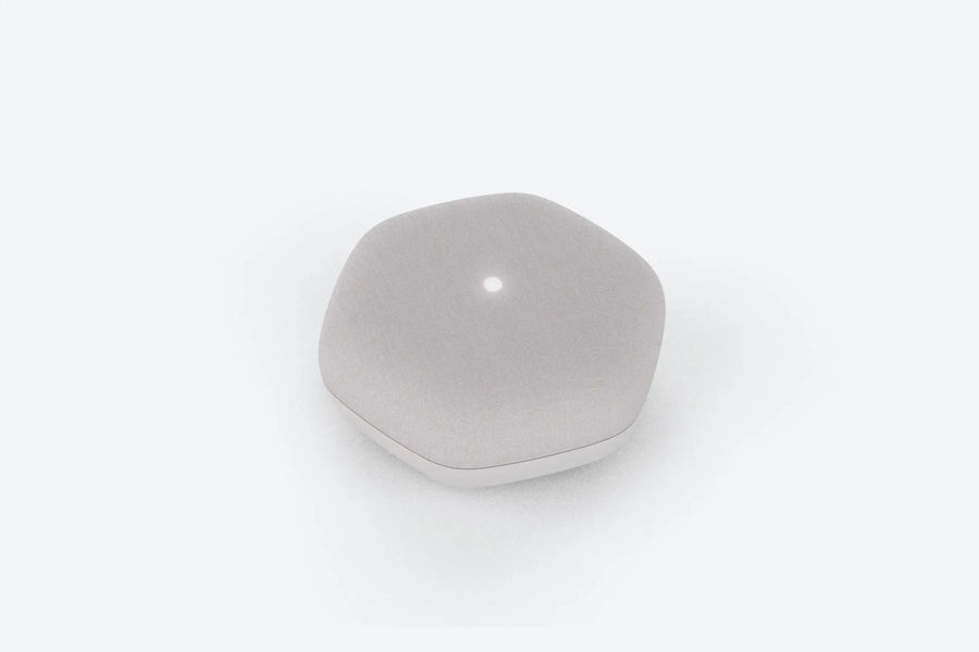 NELA Cough monitoring device, a small rounded white unit on a pale background