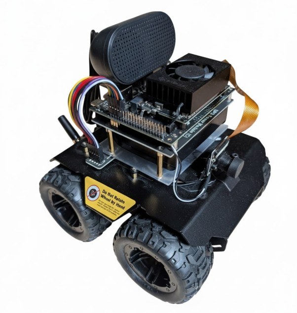 Jetson Orin Nano mounted on a small four-wheel rover chassis with a camera, speaker and cooling fan