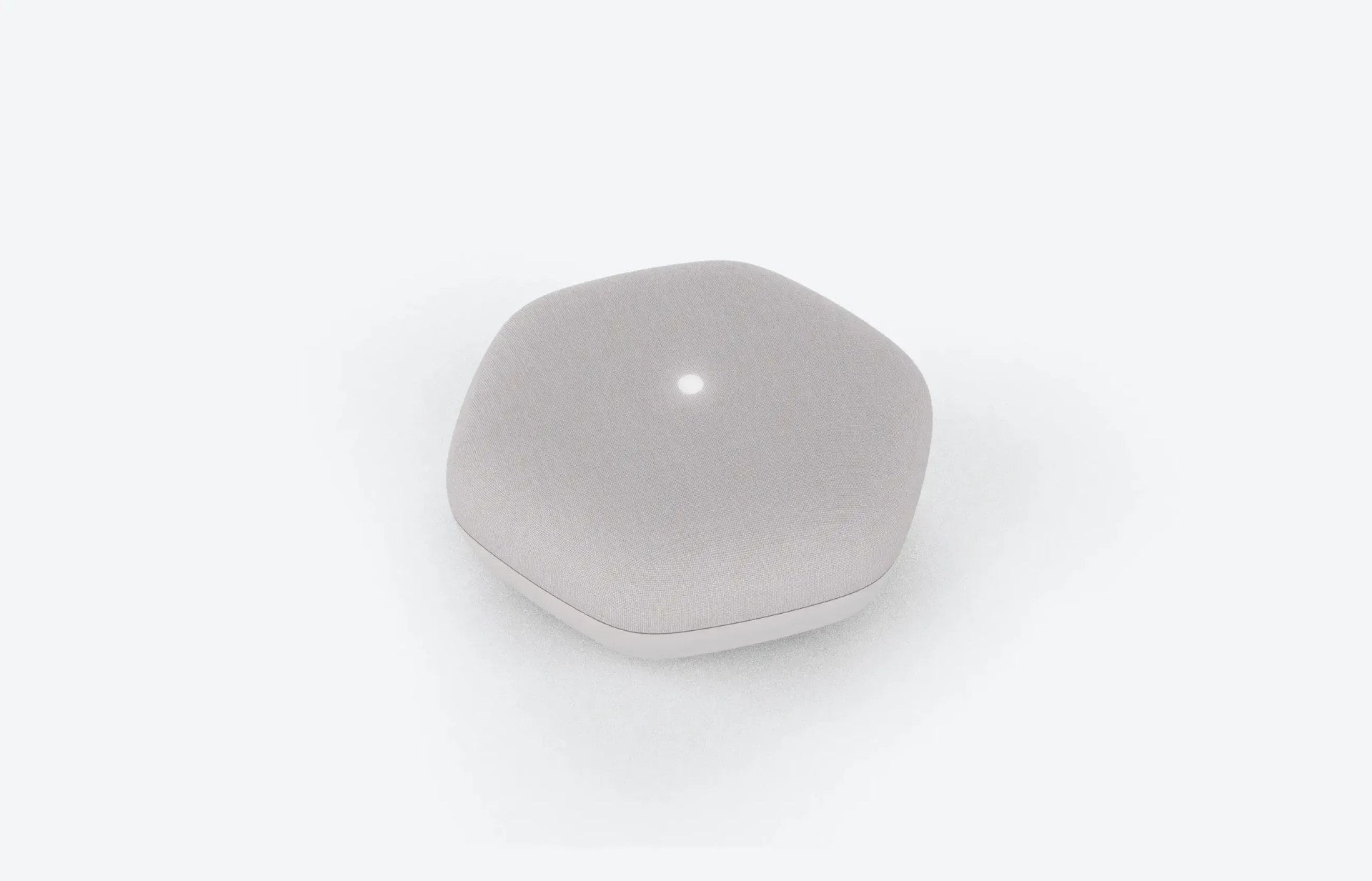 NELA Cough monitoring device, a small rounded white unit on a pale background