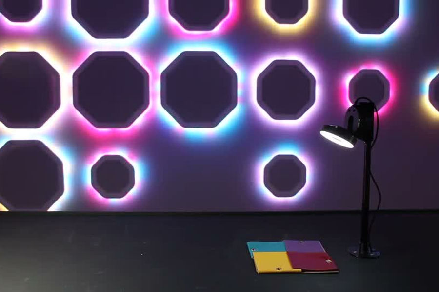 Journey of Colour light sculpture with coloured octagonal outlines, a camera and colour samples in front